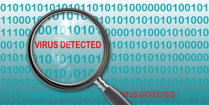 binary code with a maginifying glass detecting a virus